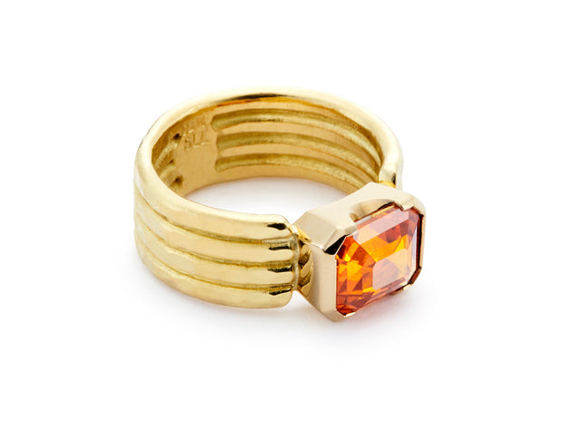 Emerald Cut Orange Sapphire set in 18kt Gold Four Band Ring